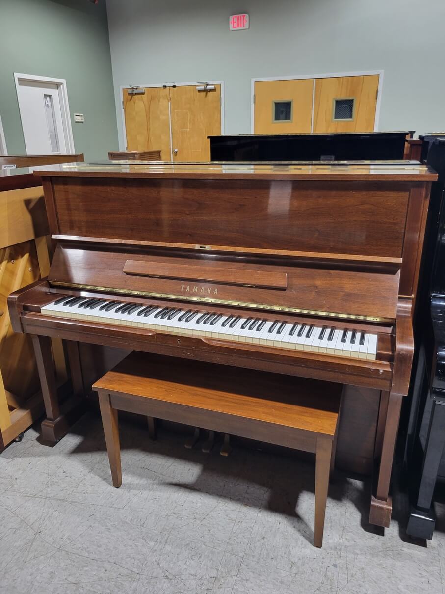 This is a detailed image displaying a 1982 Yamaha U1 Studio Piano.