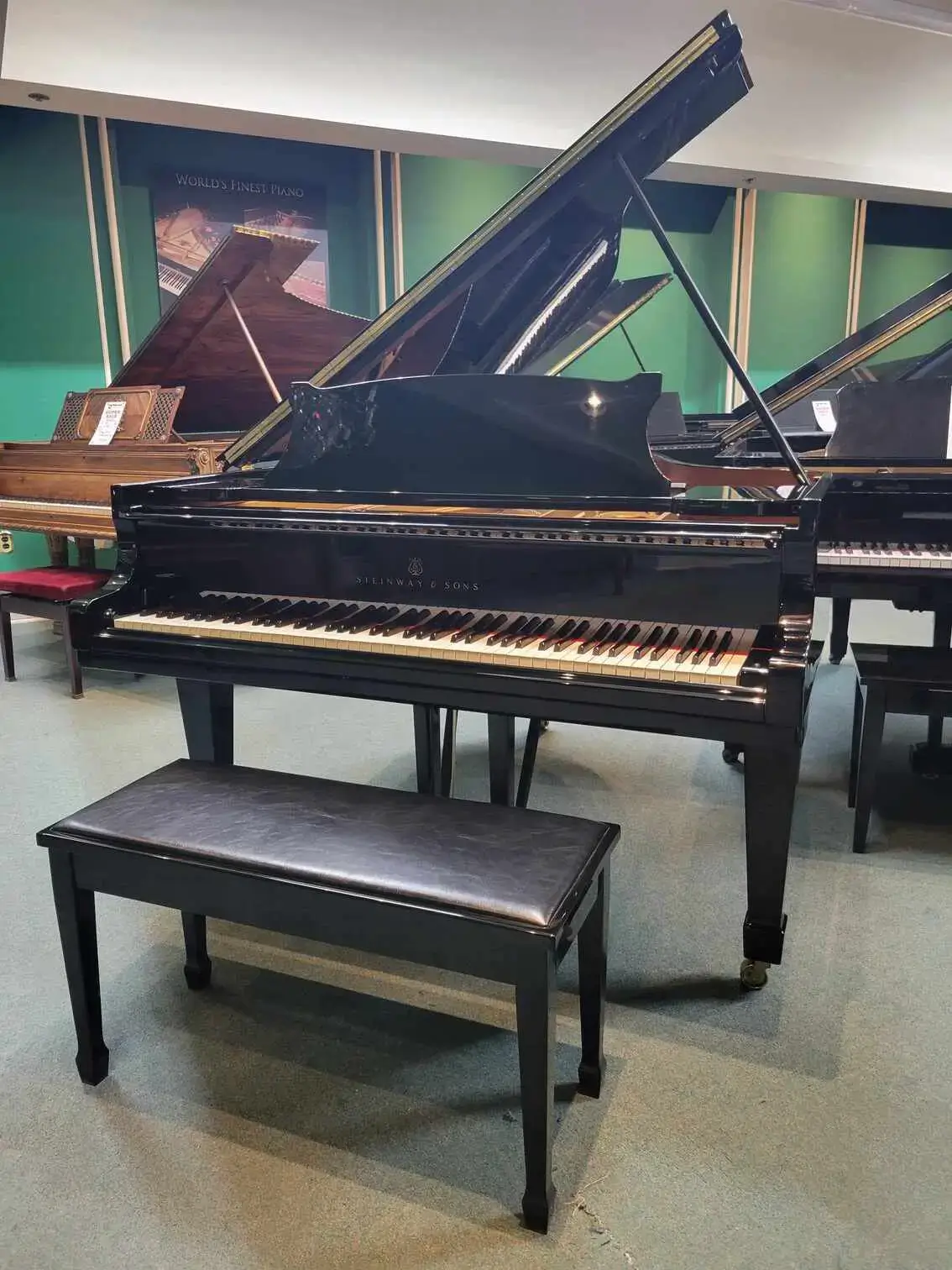 This is a detailed image displaying a 1983 Steinway Hamburg O-180 Professional Grand Piano.